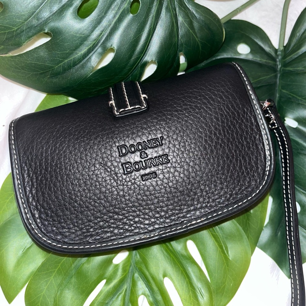 NWOT!! Dooney and Bourke black Flap Wristlet. Genuine leather